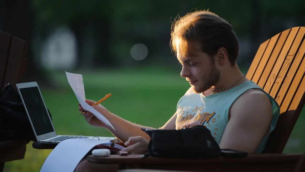 A student studying on the Quad